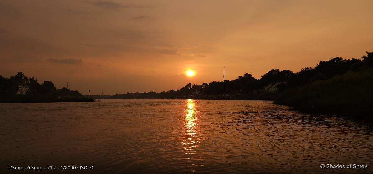 Golden sunset reflecting on river waters