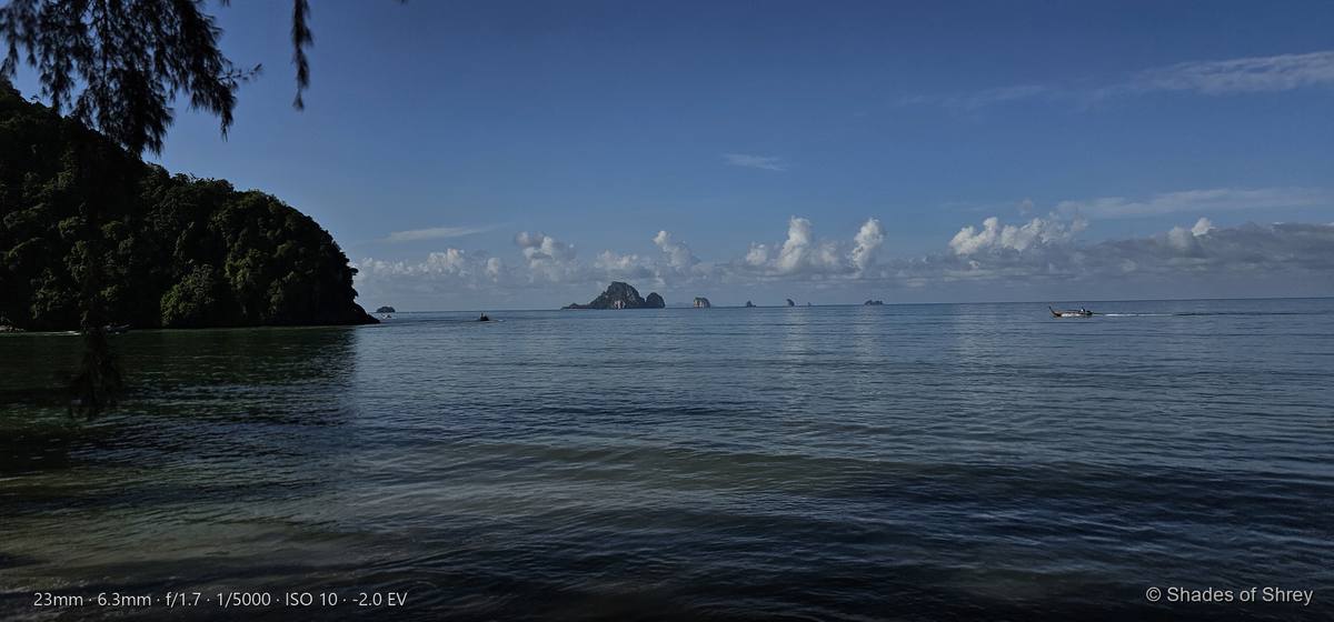 Turquoise sea meeting lush green coastline on a tropical island