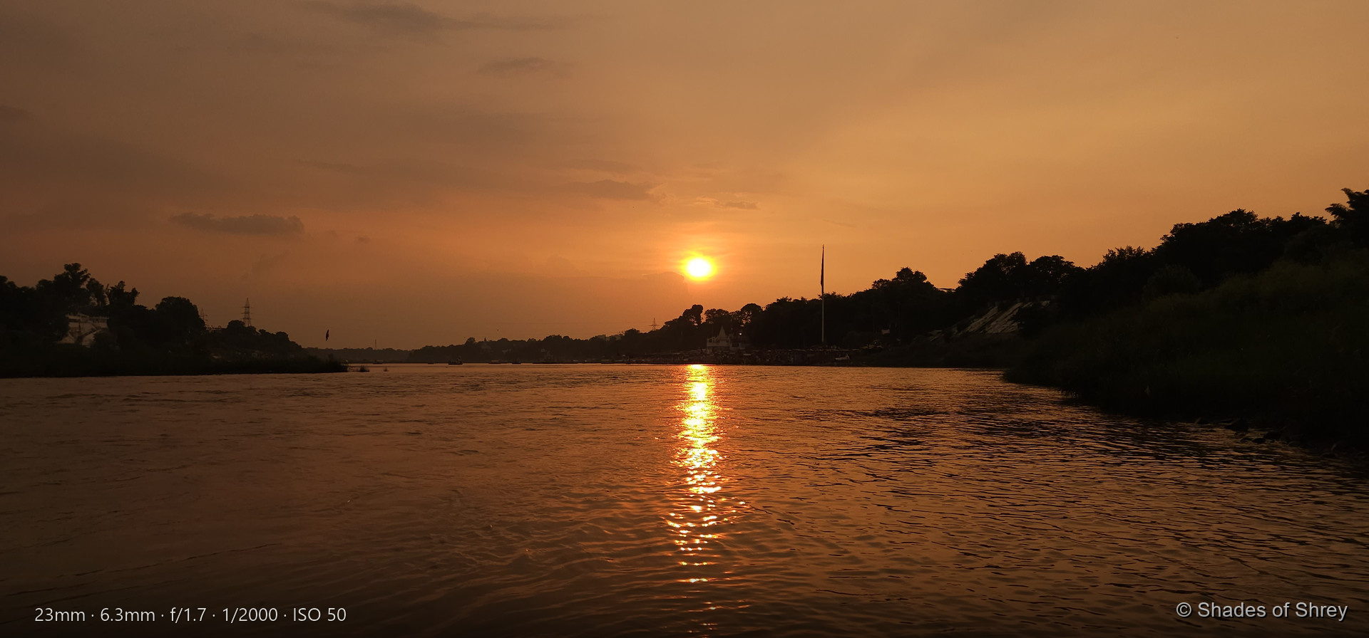 Golden sunset reflecting on river waters