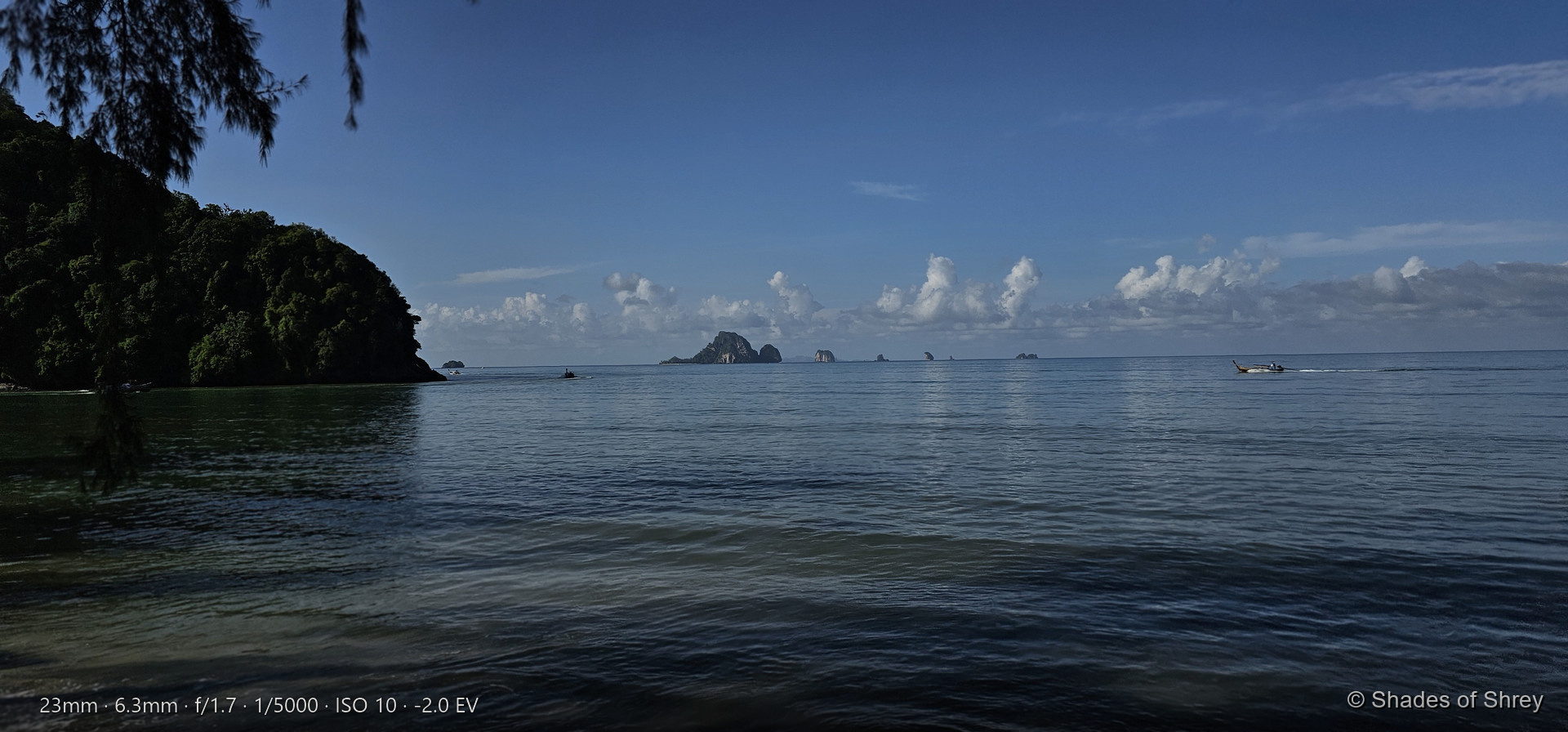 Turquoise sea meeting lush green coastline on a tropical island